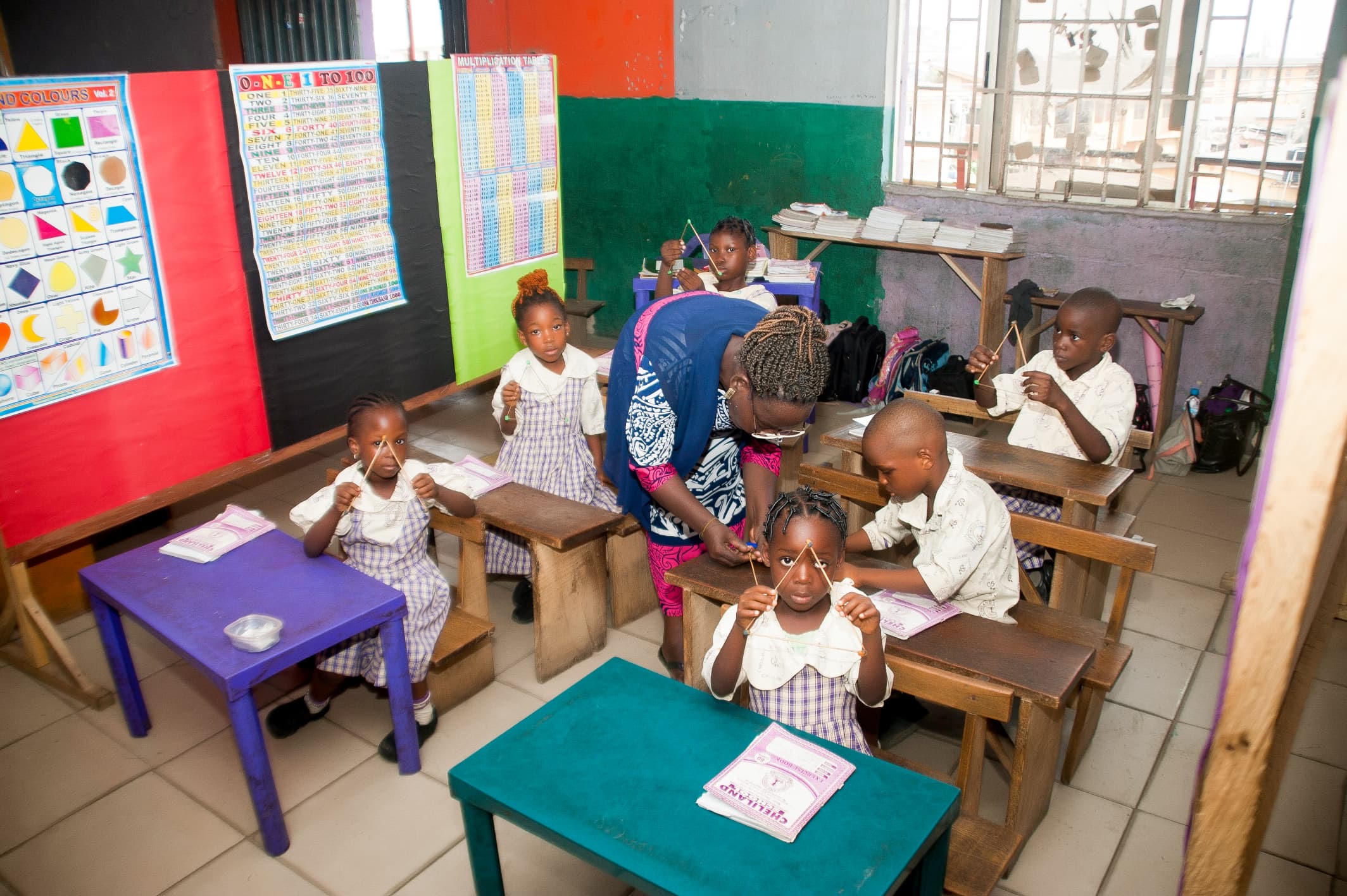 Teacher Helping Students